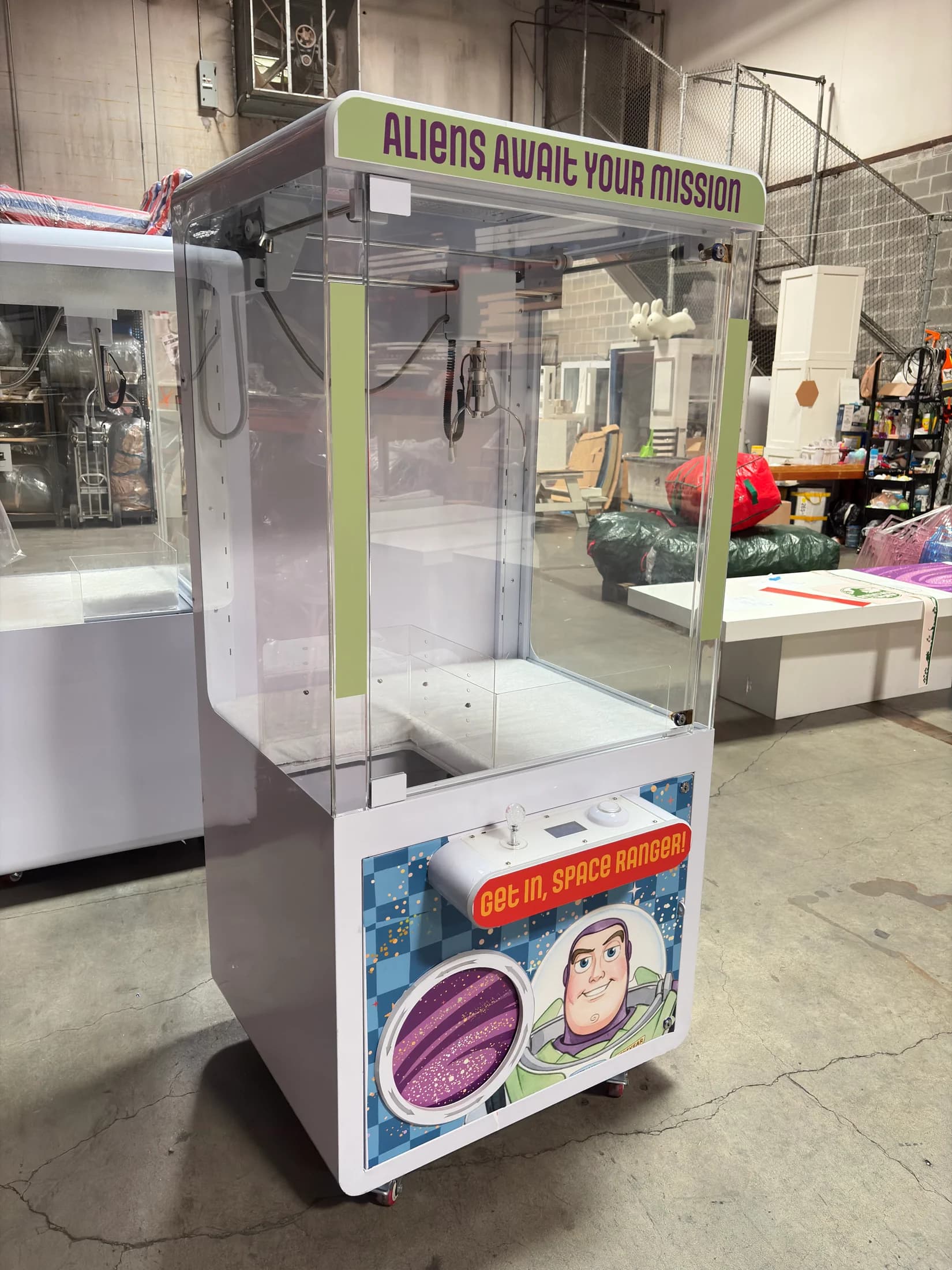 Space-themed branded claw machine