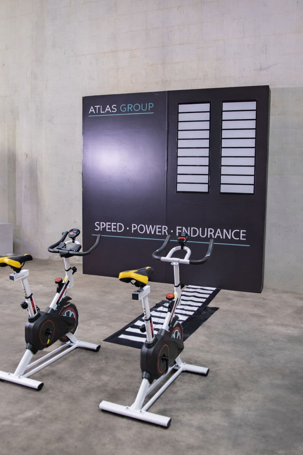 Guests racing on pedal power bikes at a Texas activation