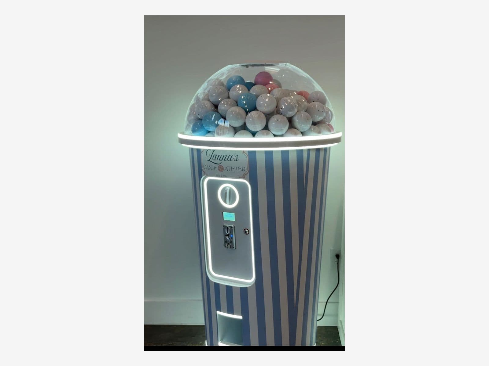 Cone shaped gumball style gashapon machine rental at a Houston brand activation