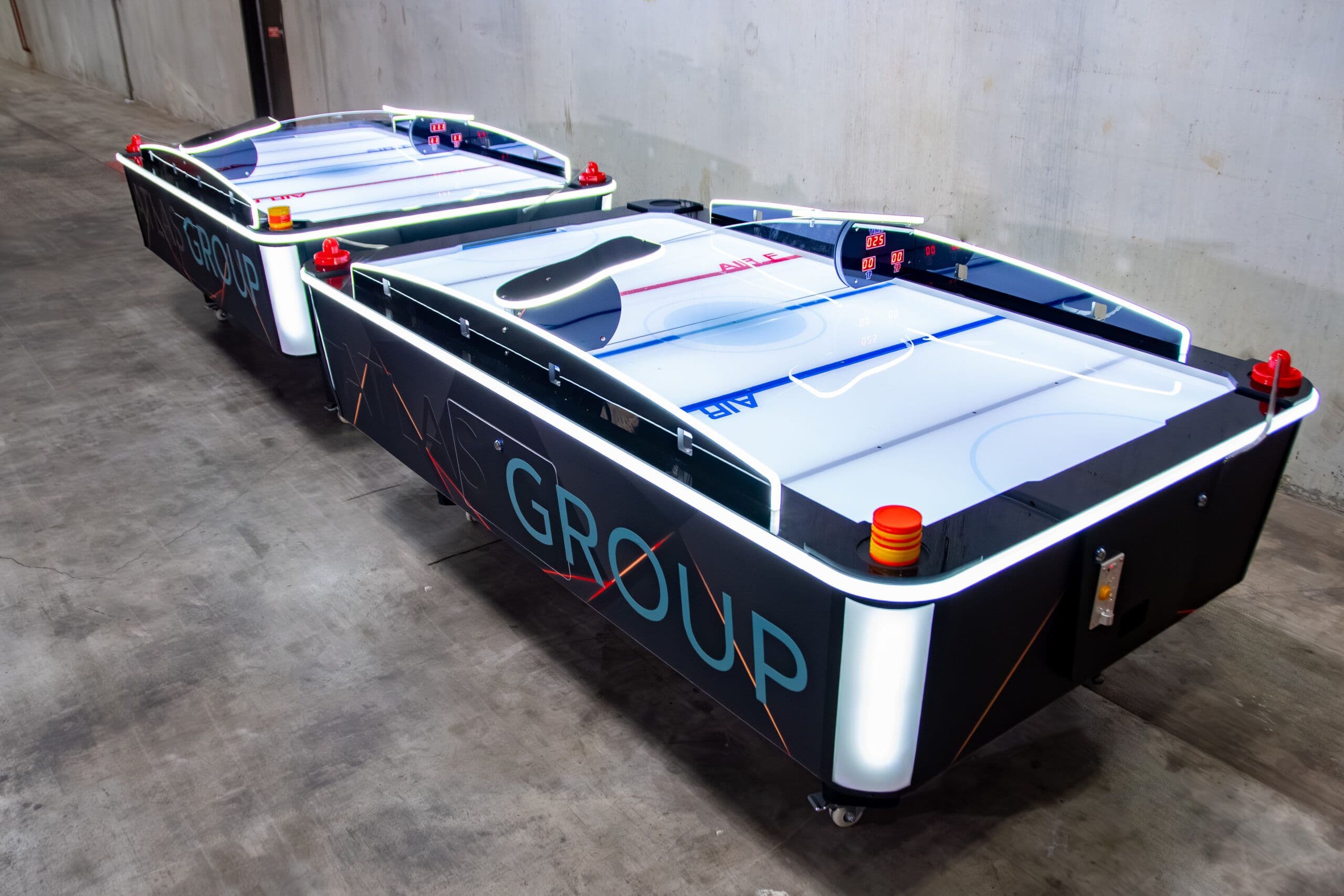 LED air hockey table rental glowing at a Houston corporate event