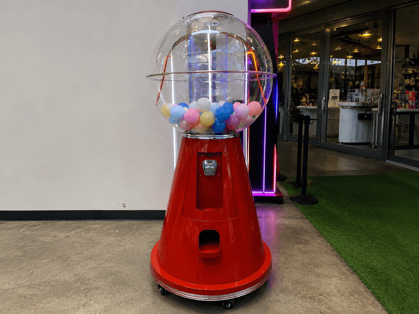 Manual giant spherical gashapon gumball machine rental at a Houston event
